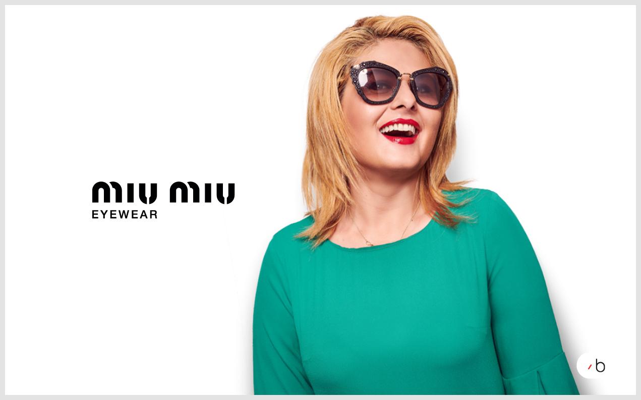 Female model wearing Miu miu sunglasses for women